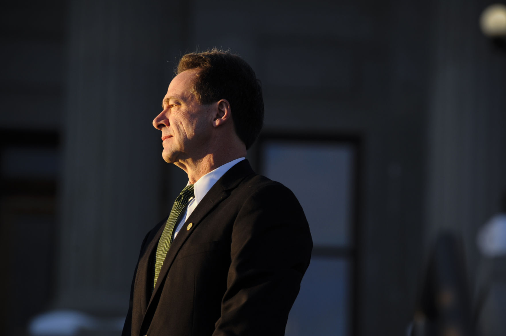 Gov. Steve Bullock stands on the steps of the Montana State Capitol.